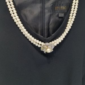 Vintage  black  pant suit.  No sleeves  pearls attached. 20 inches pit to pit